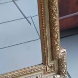 Antique mirror in wood and gilded stucco, neo Louis XVI style.