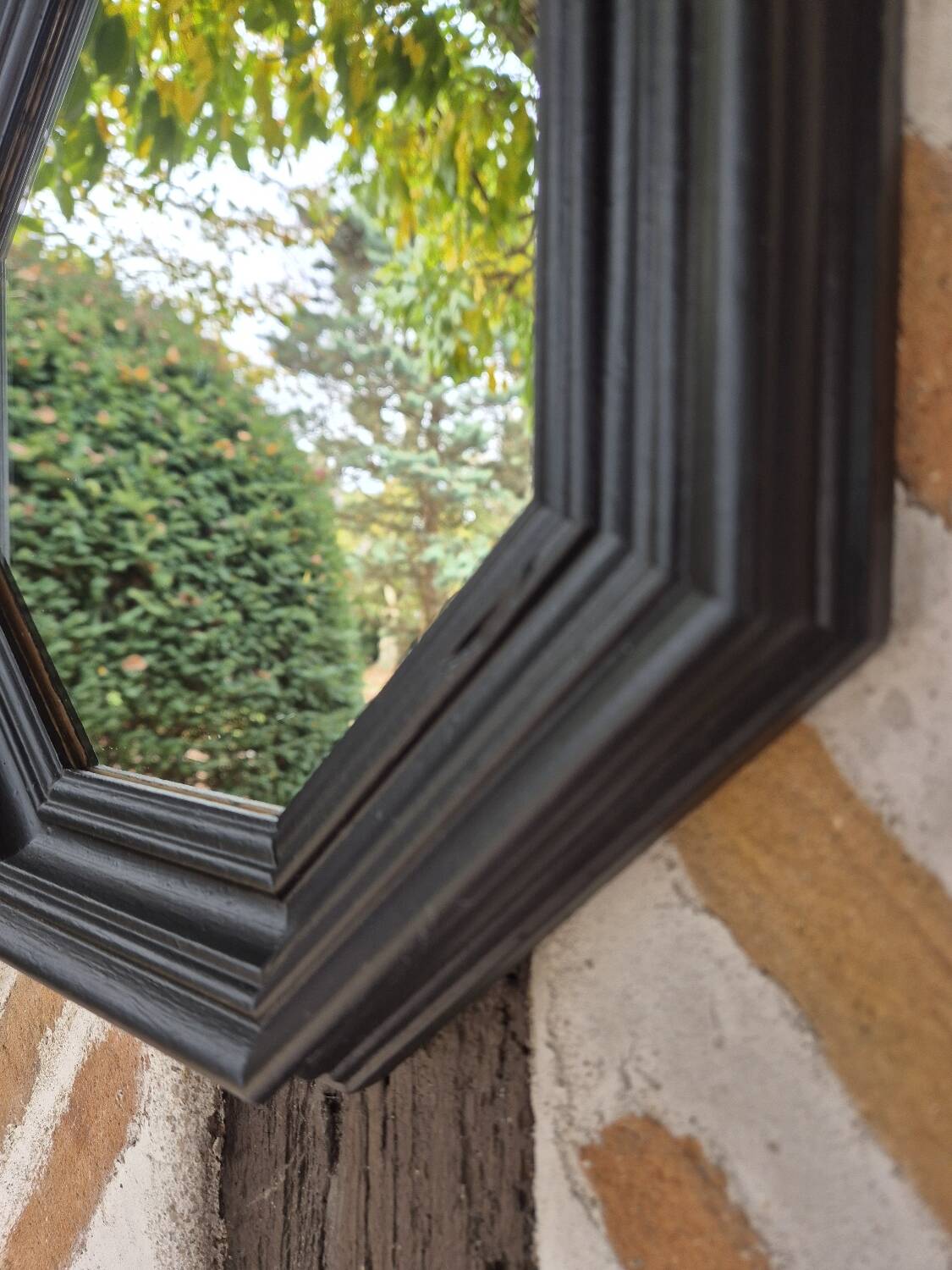Octagonal black wood mirror