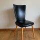 Black chair with compass legs