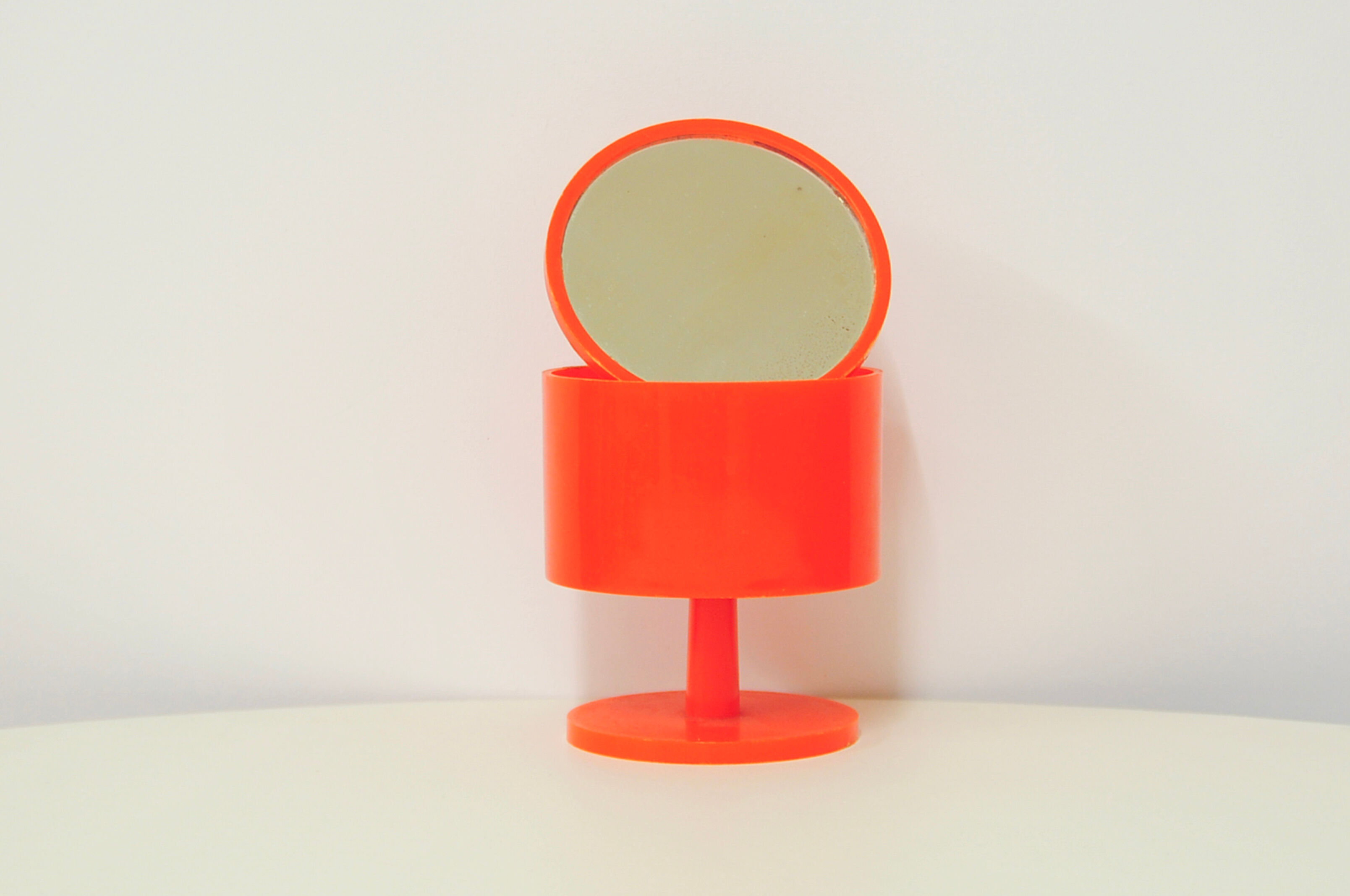 Space Age orange plastic makeup mirror