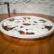 Enamelled cast iron table mat