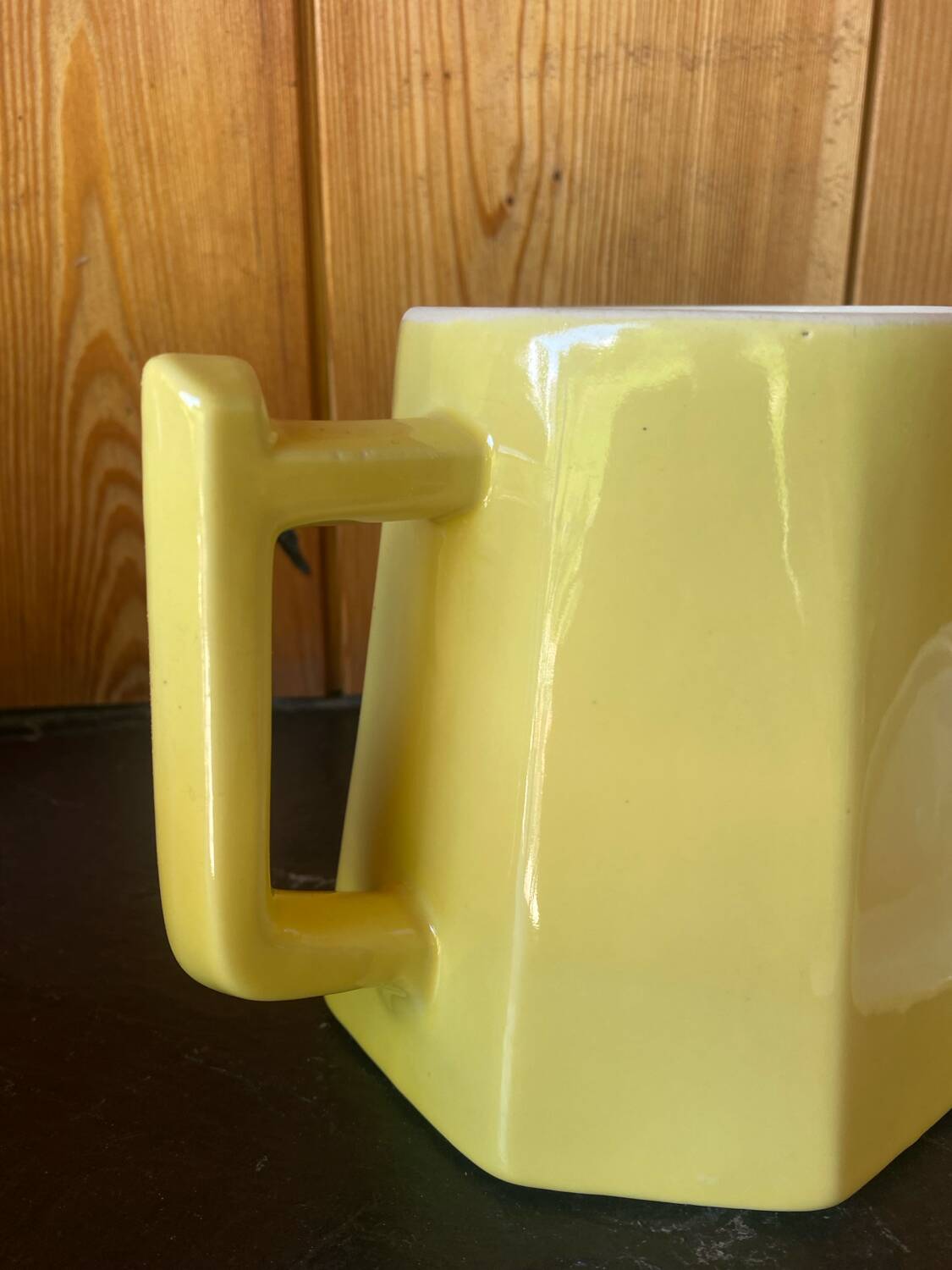 Vintage yellow ceramic teapot and milk jug.