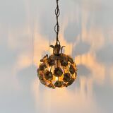 Vintage floral motif pendant, gold metal, France, 1970.