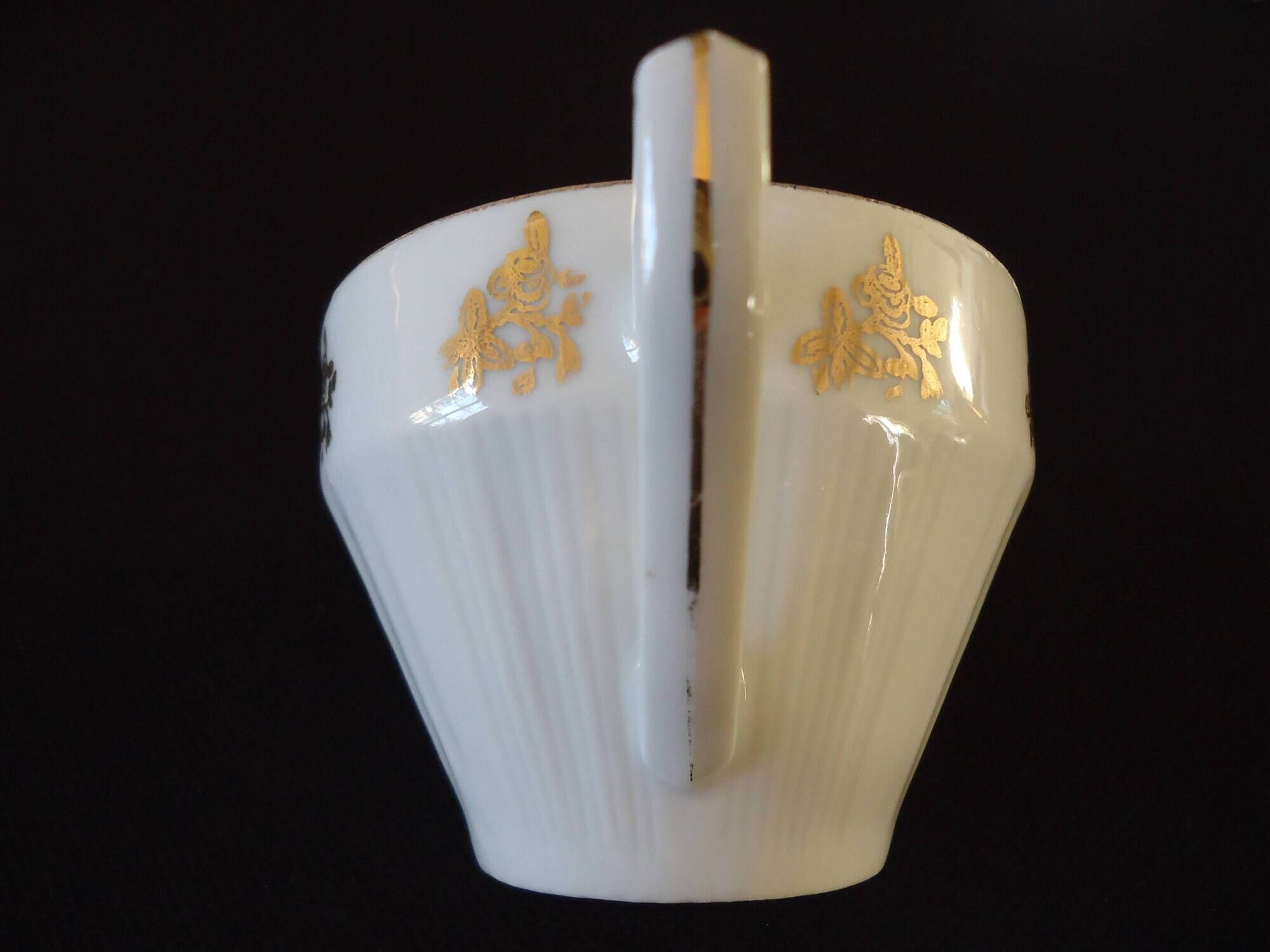 Set of six Art Deco white fine porcelain coffee cups and saucers