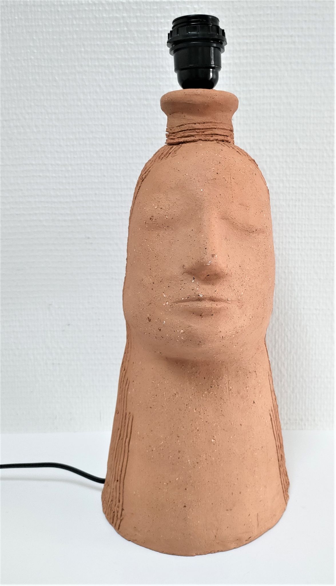Anthropomorphic lamp foot depicting two faces terracotta design 80s