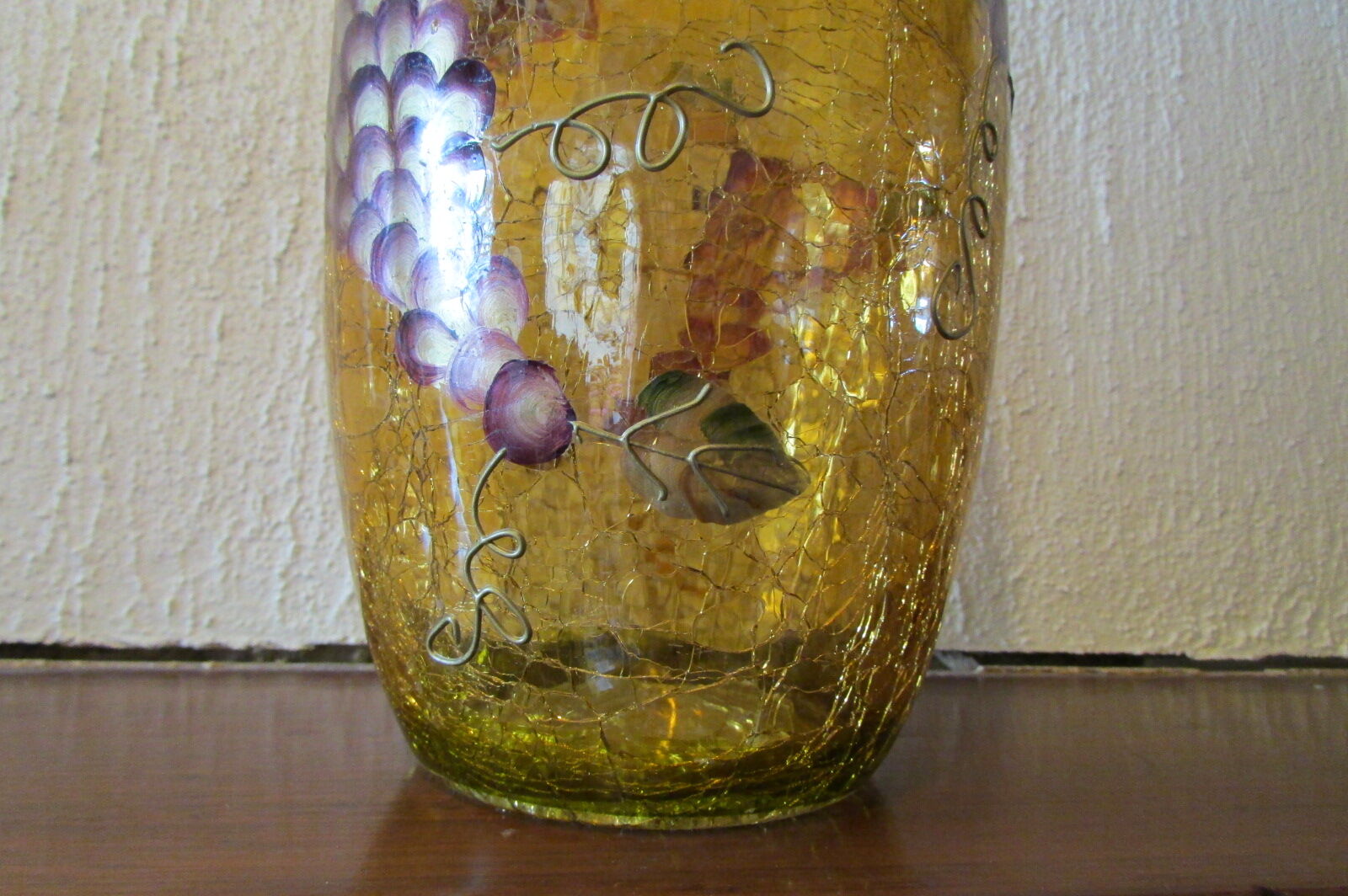 Yellow glass vase, cracked paint, grape motifs