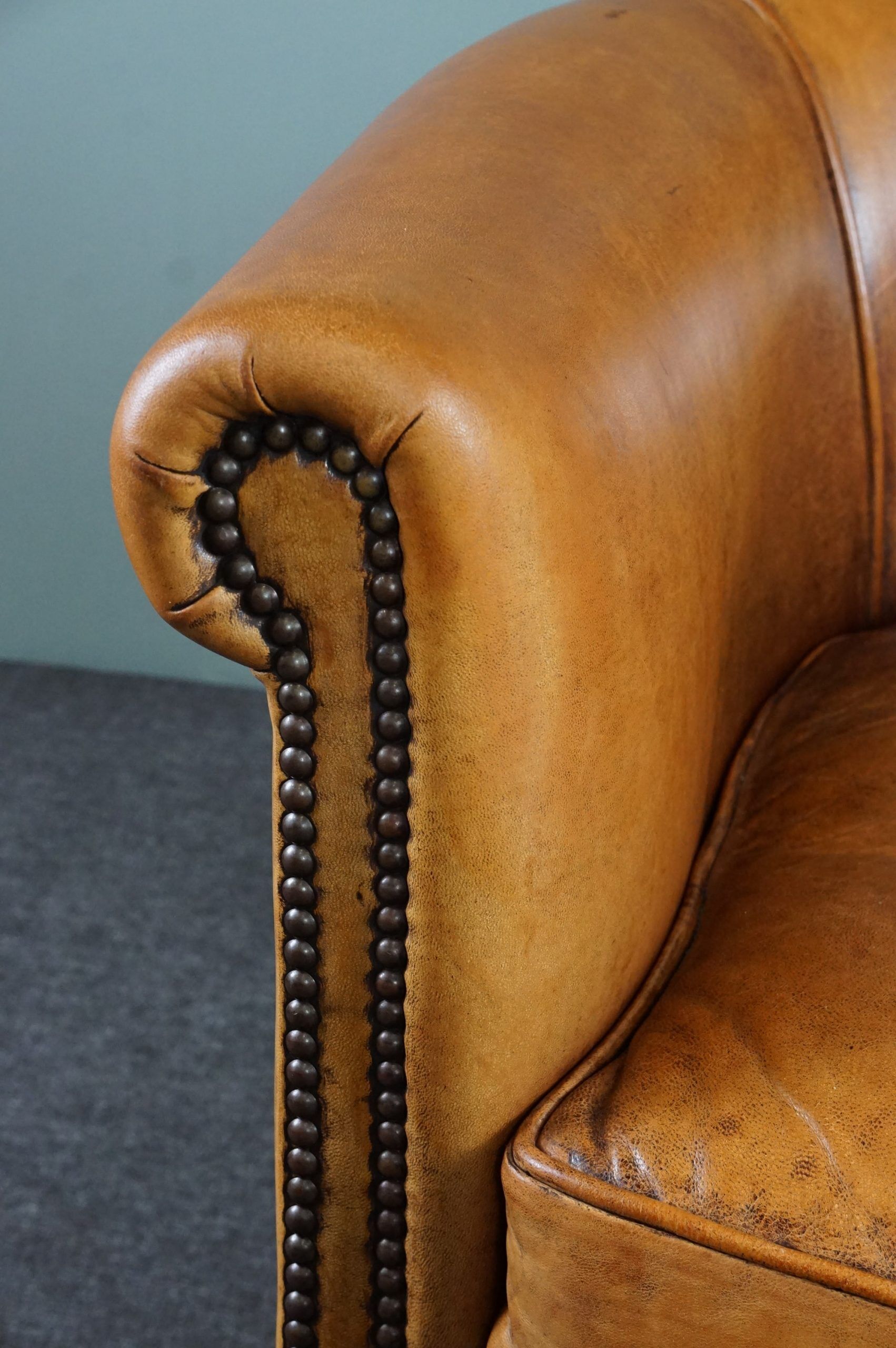 Club armchair in cognac-colored sheepskin