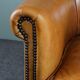 Club armchair in cognac-colored sheepskin