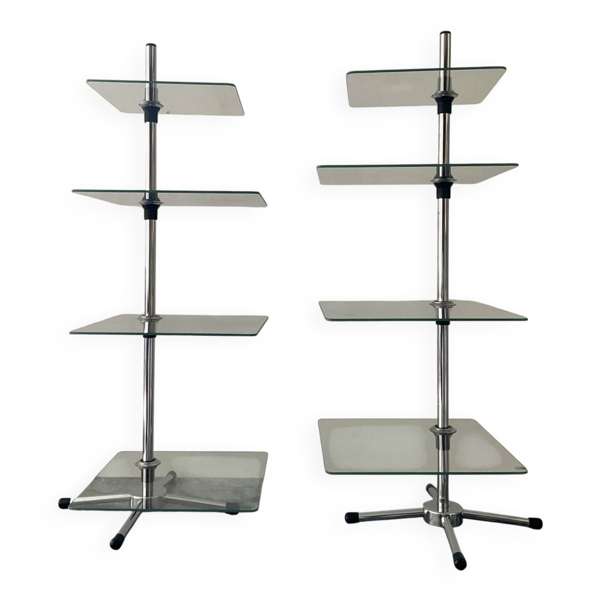 A pair of vintage side tables in glass and chrome metal.