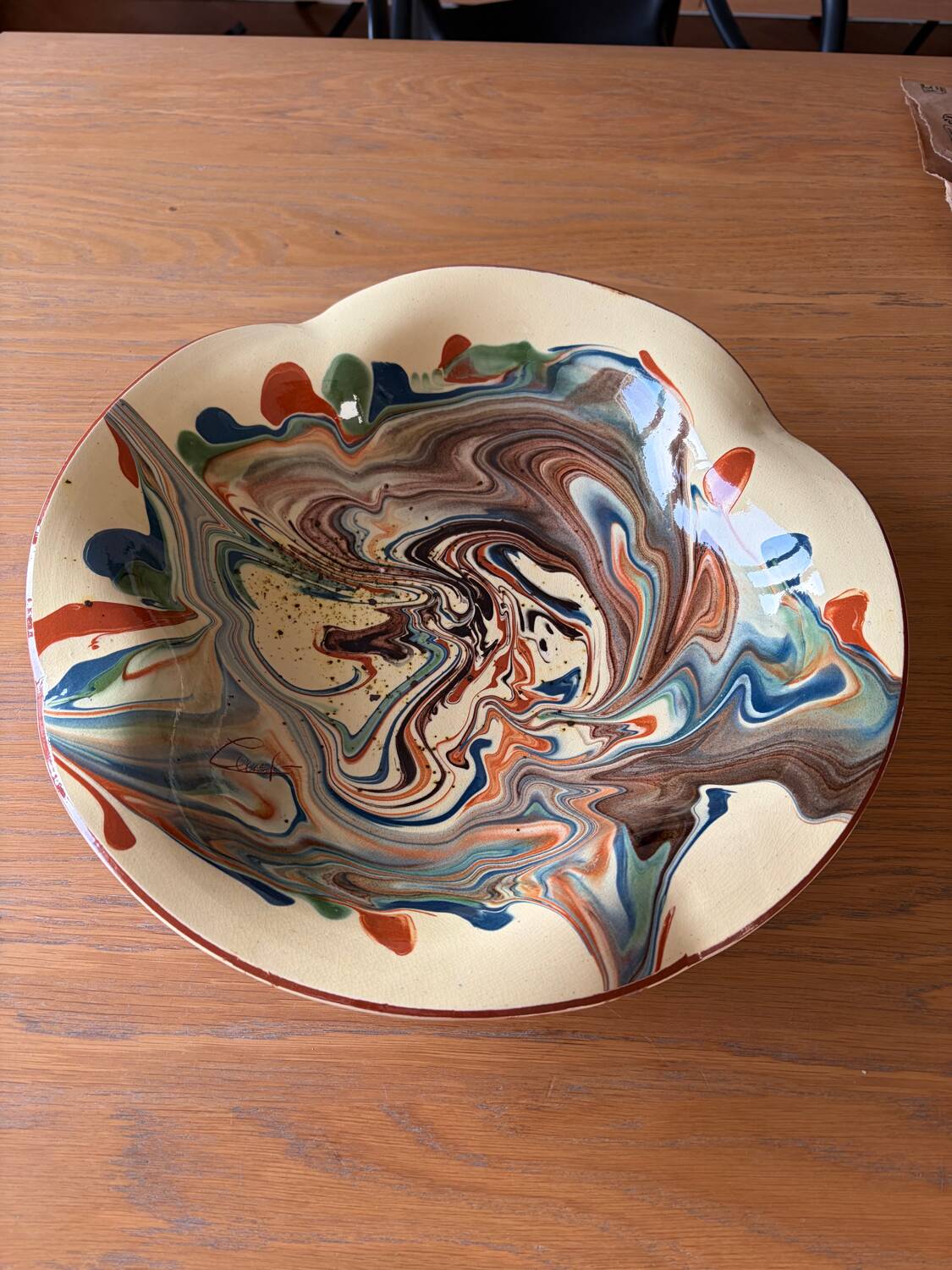 Glazed ceramic plate signed