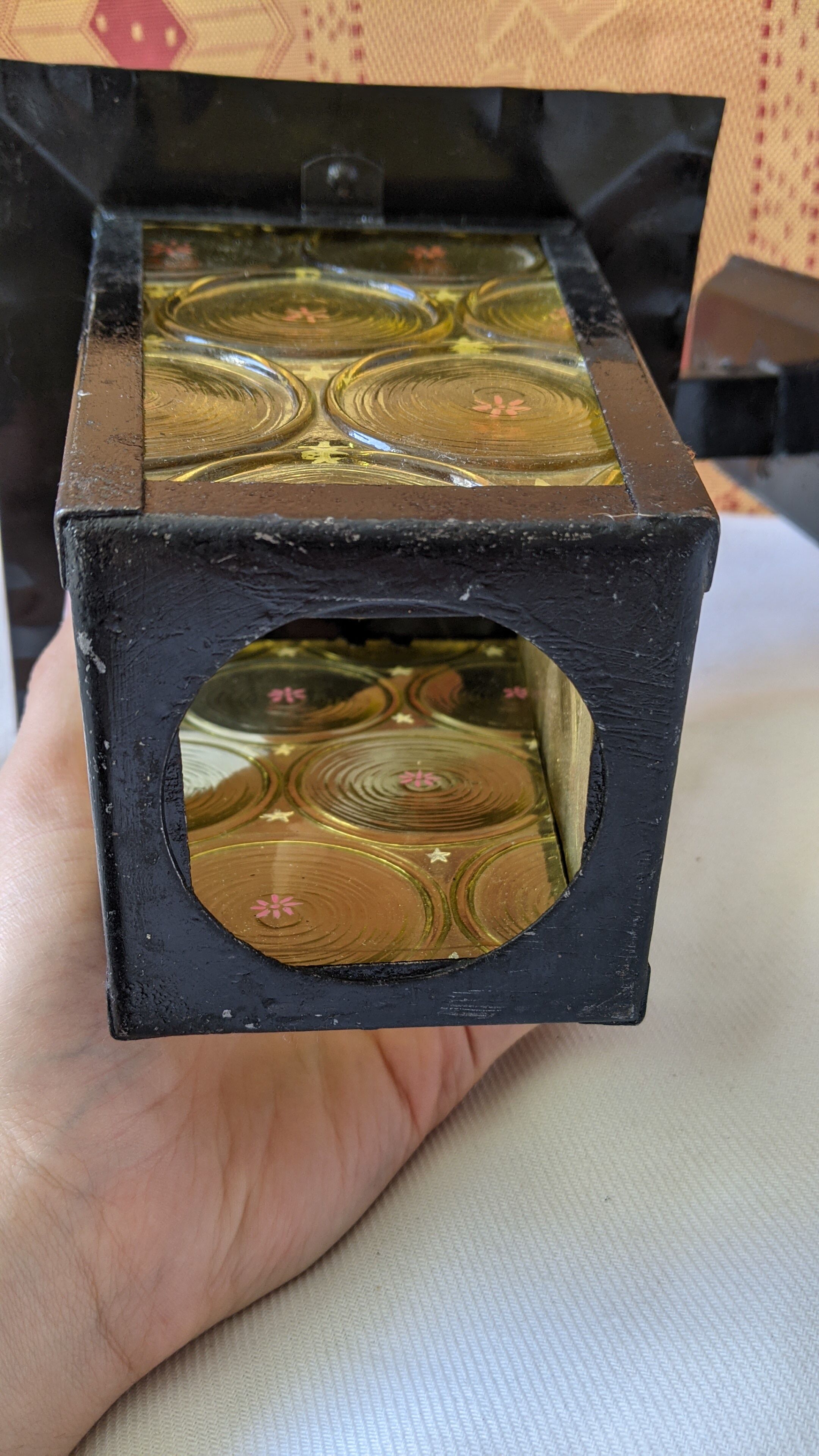 Pretty iron and glass lantern In very good condition black iron color of yellow glass relief circ