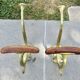Pair of Art Nouveau coat hooks in bronze and chestnut, circa 1930.