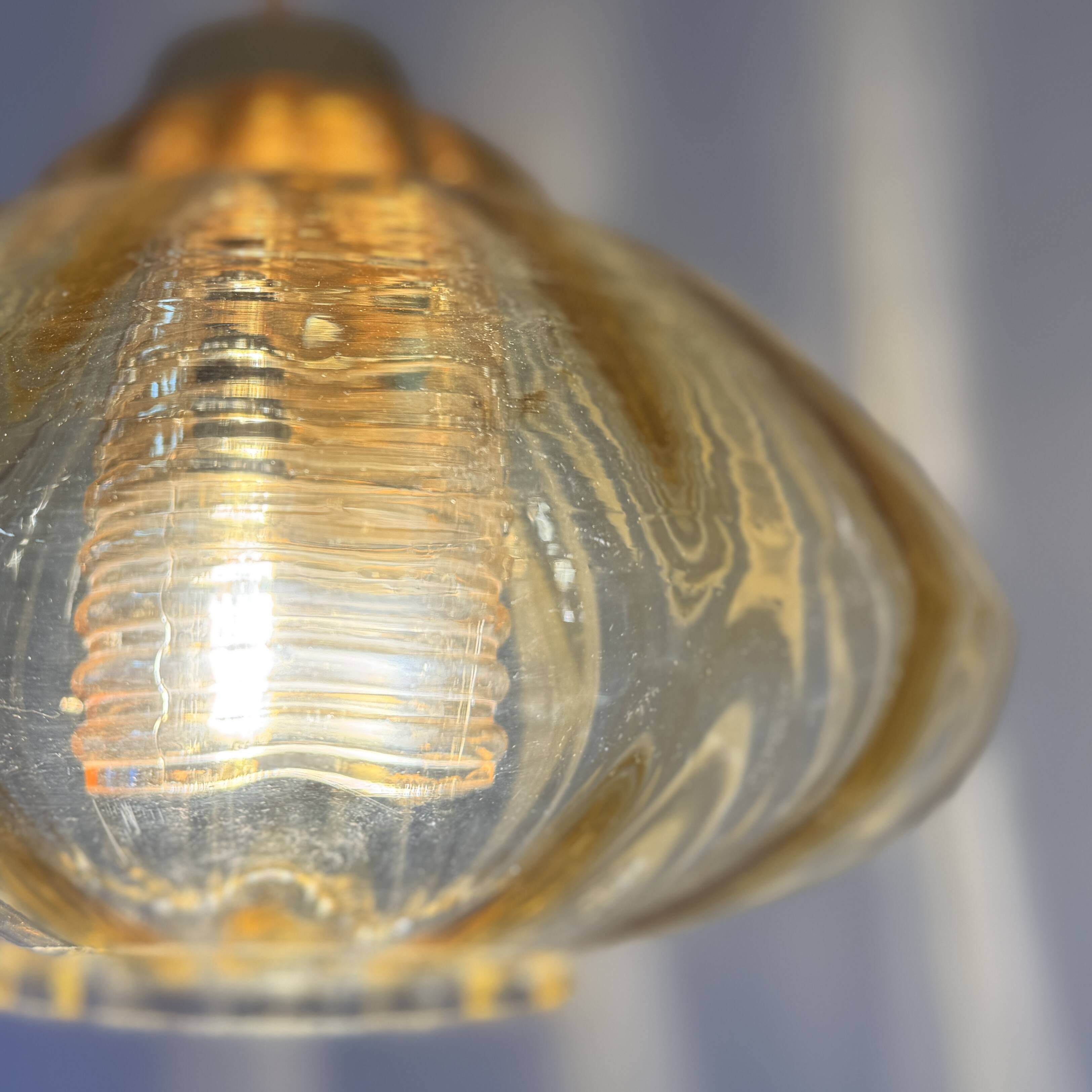 Vintage pendant lamp with amber glass shade