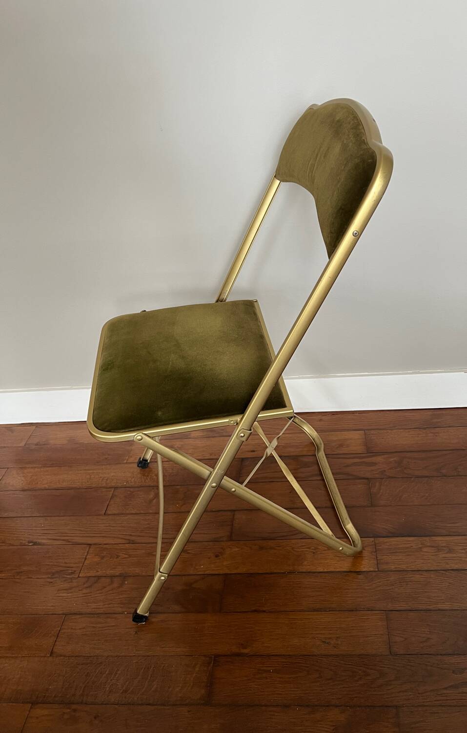 Green velvet folding chair
