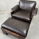 Vintage Leolux brown leather/oak lounge chair and ottoman by Harry de Groot – 1970