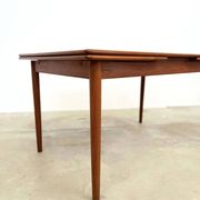 Teak dining table with integrated extensions — Scandinavian