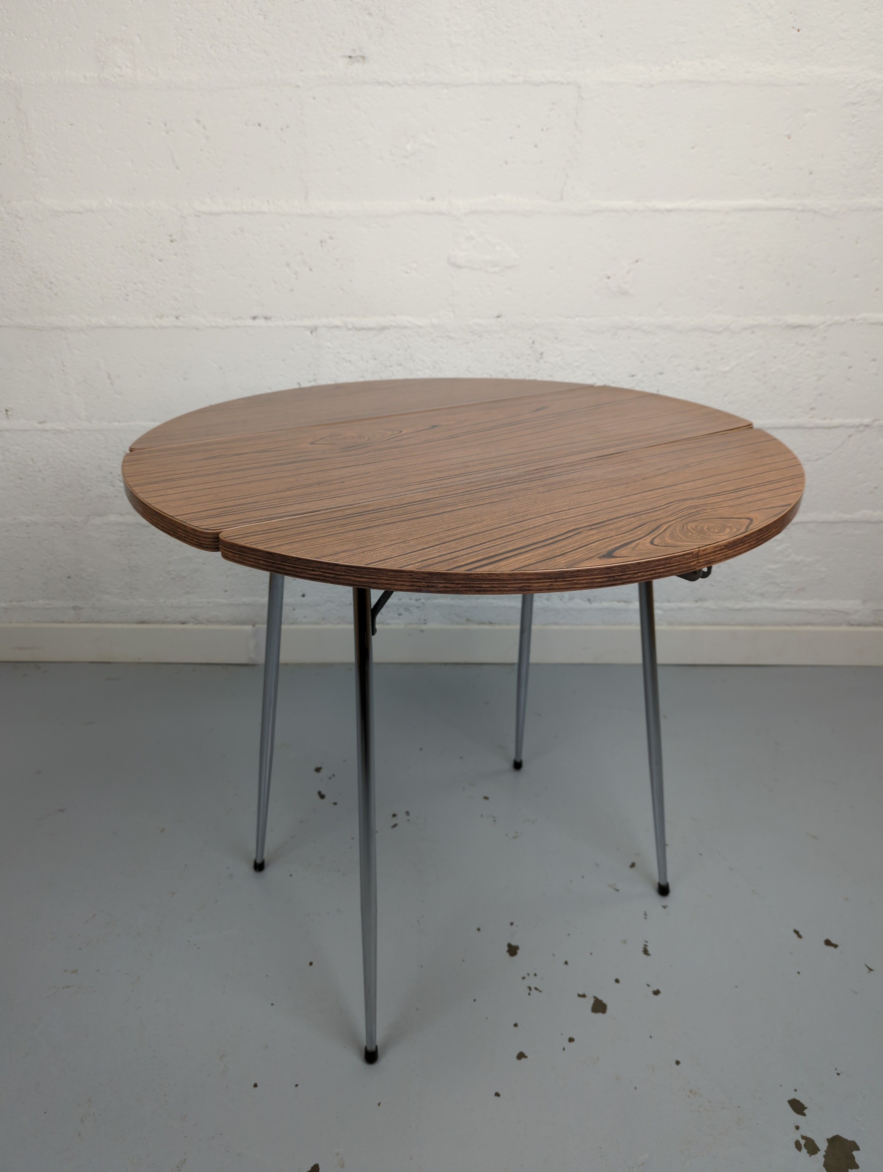 Foldable brown formica table compass legs