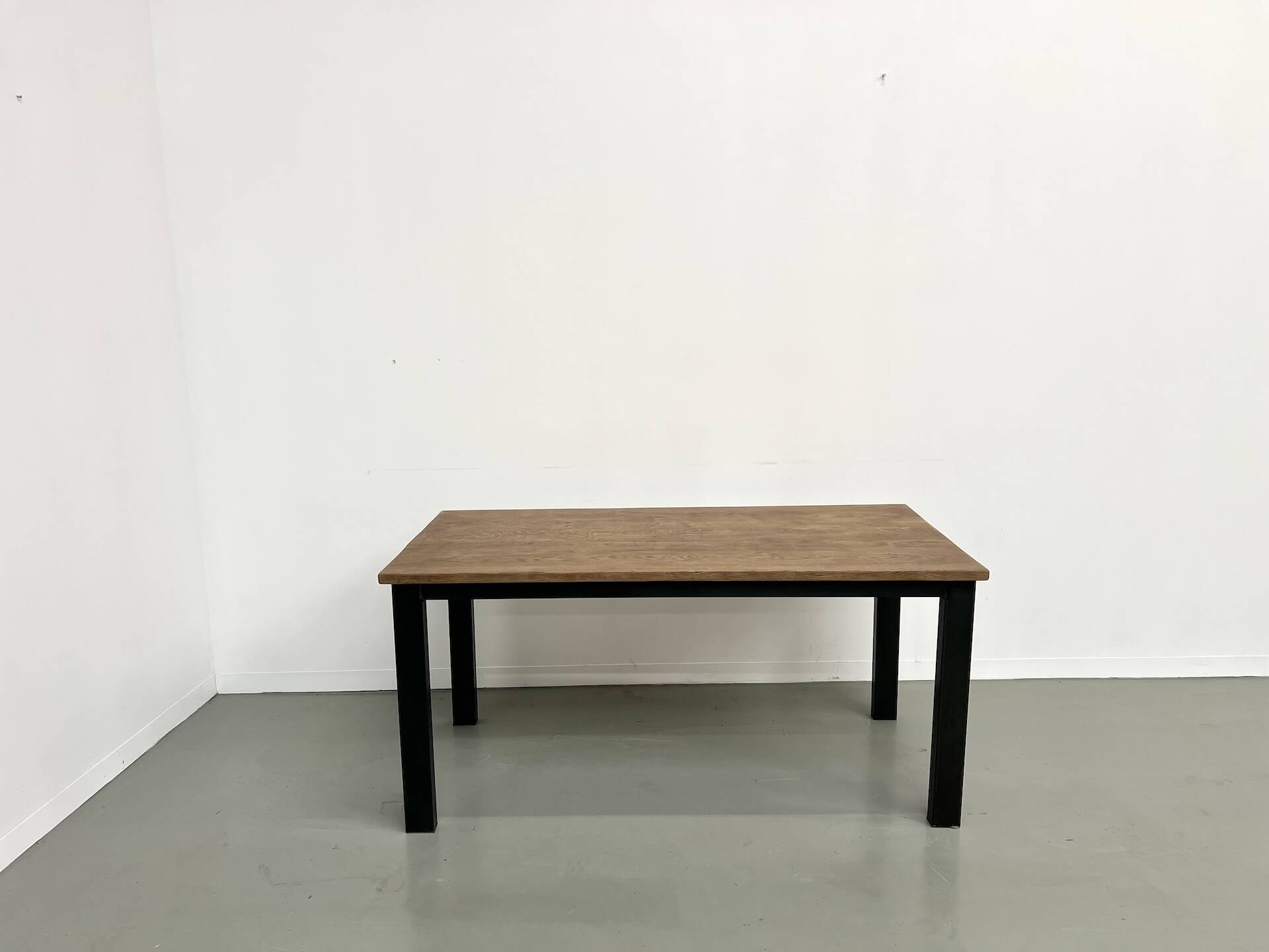 Solid oak dining table from the 70s with metal legs