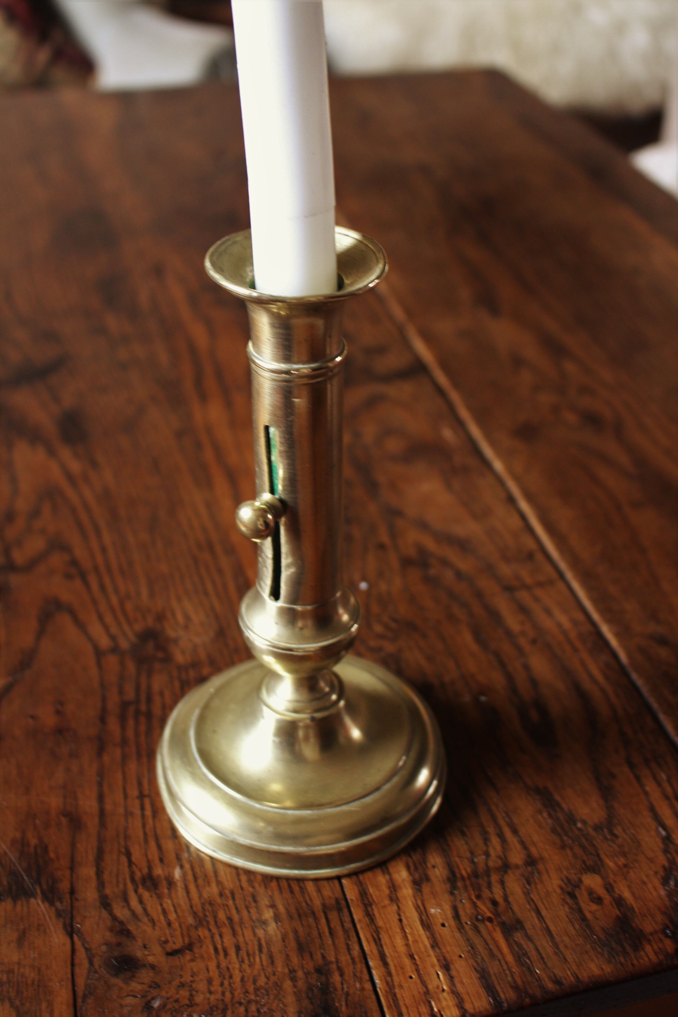 Brass pusher torch candle holder