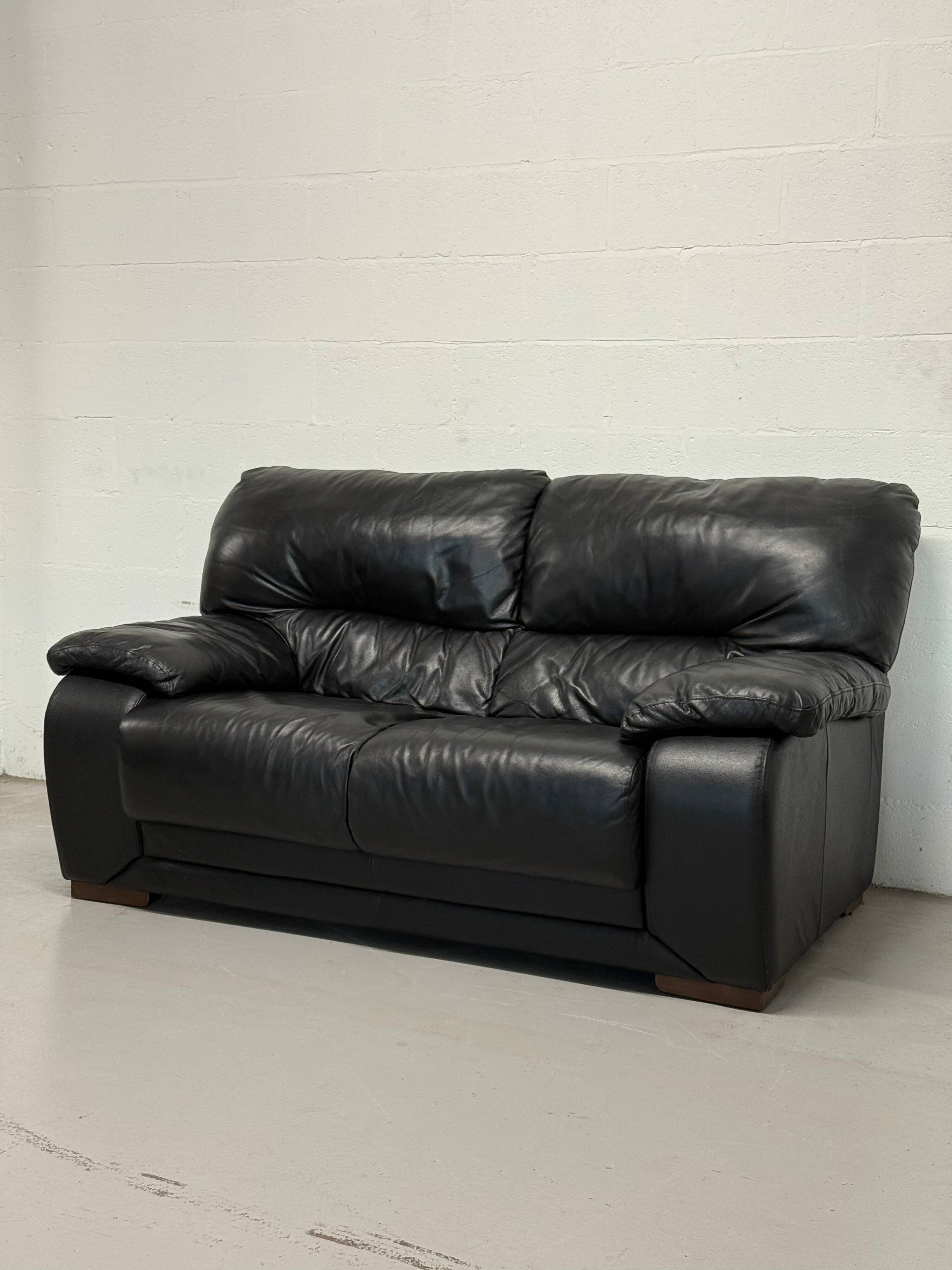 Two-seater black leather sofa — Italian postmodern design