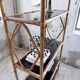 Rattan bookshelf and black glasses