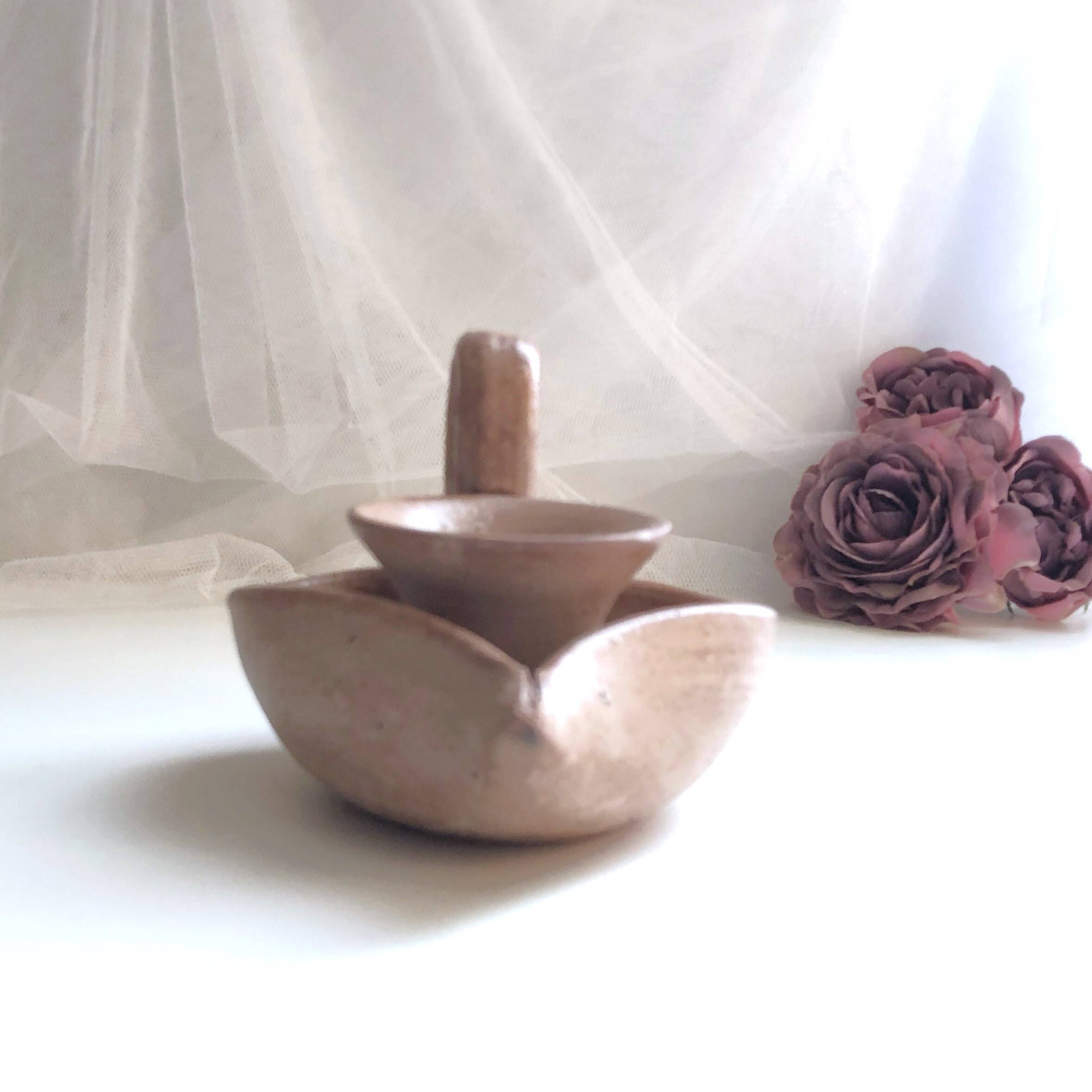 Glazed stoneware heart-shaped hand candle holder