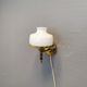 Older wall lamp, in metal, brass and milk-white glass