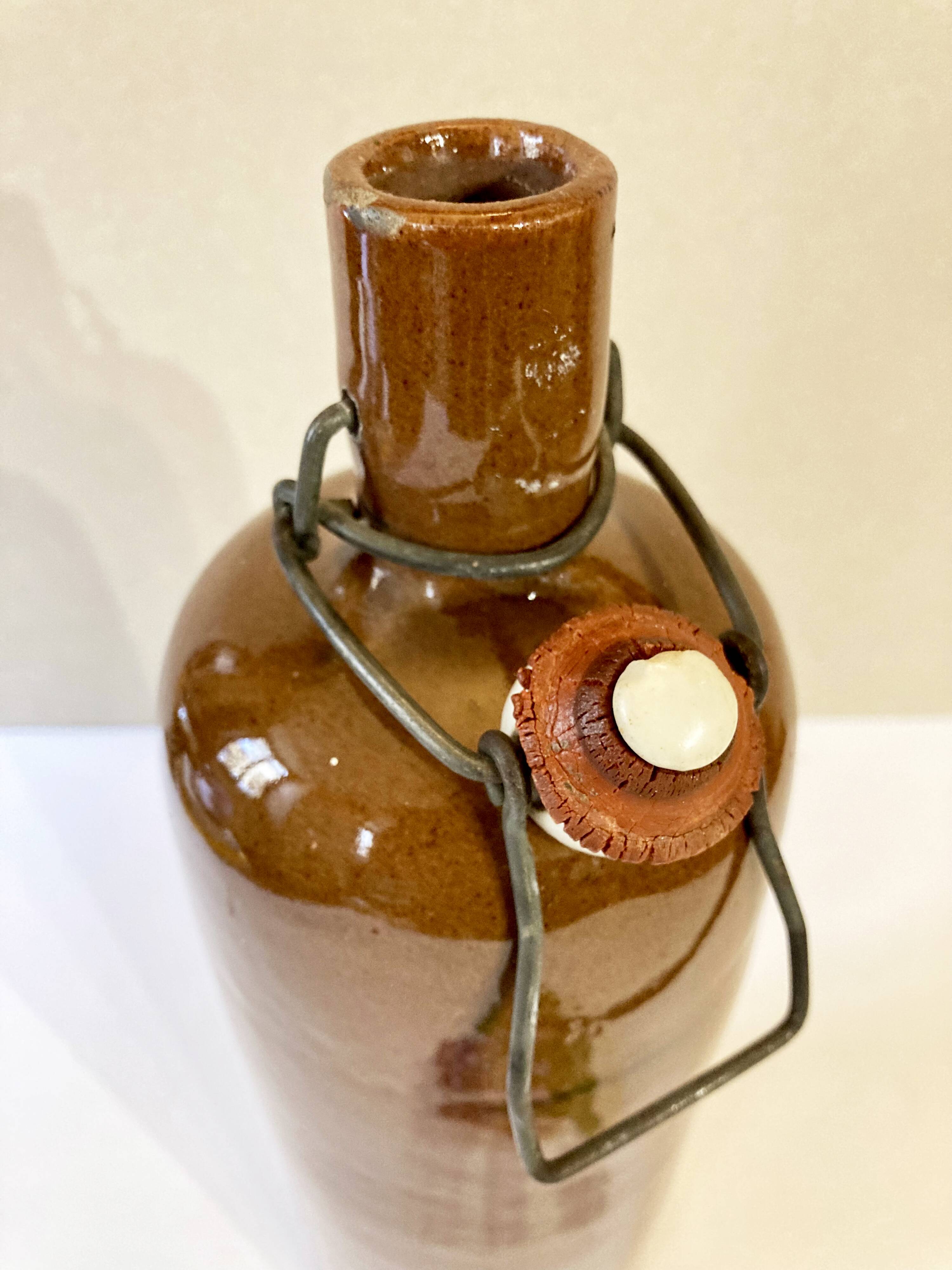 Bottle / hot water bottle in brown enamelled stoneware