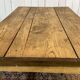 Extendable oak table from the 1930s with Gothic decoration.
