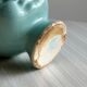 Cache-pot turquoise en forme de tête de poupée vintage