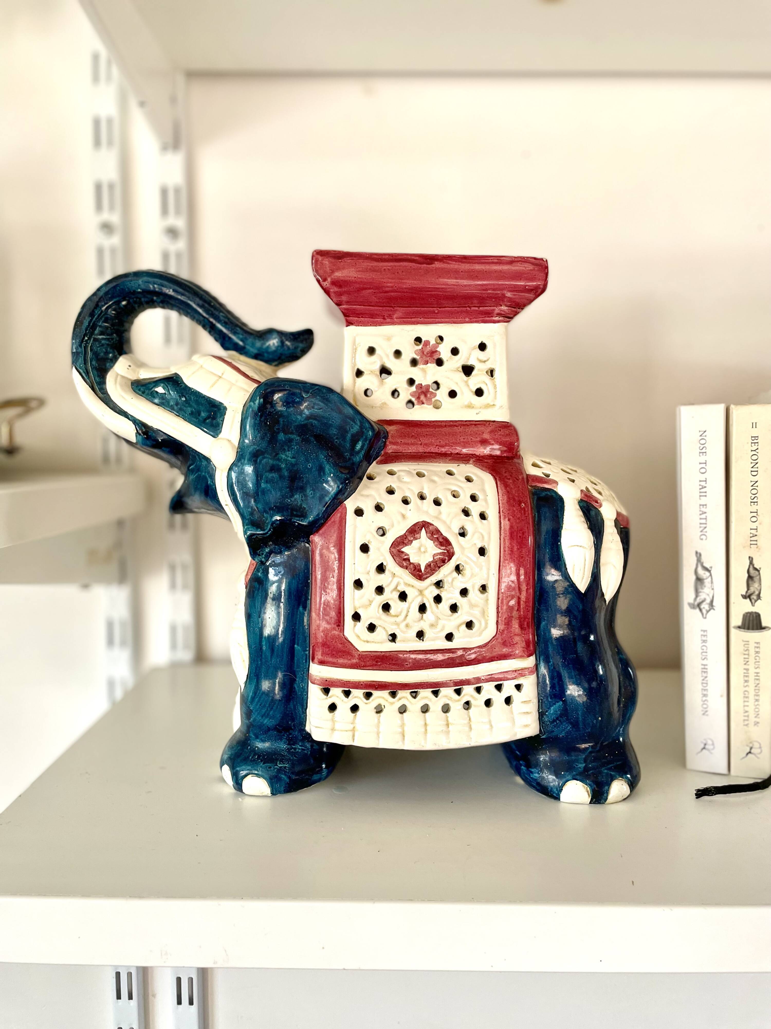 Blue and red ceramic elephant plant stand