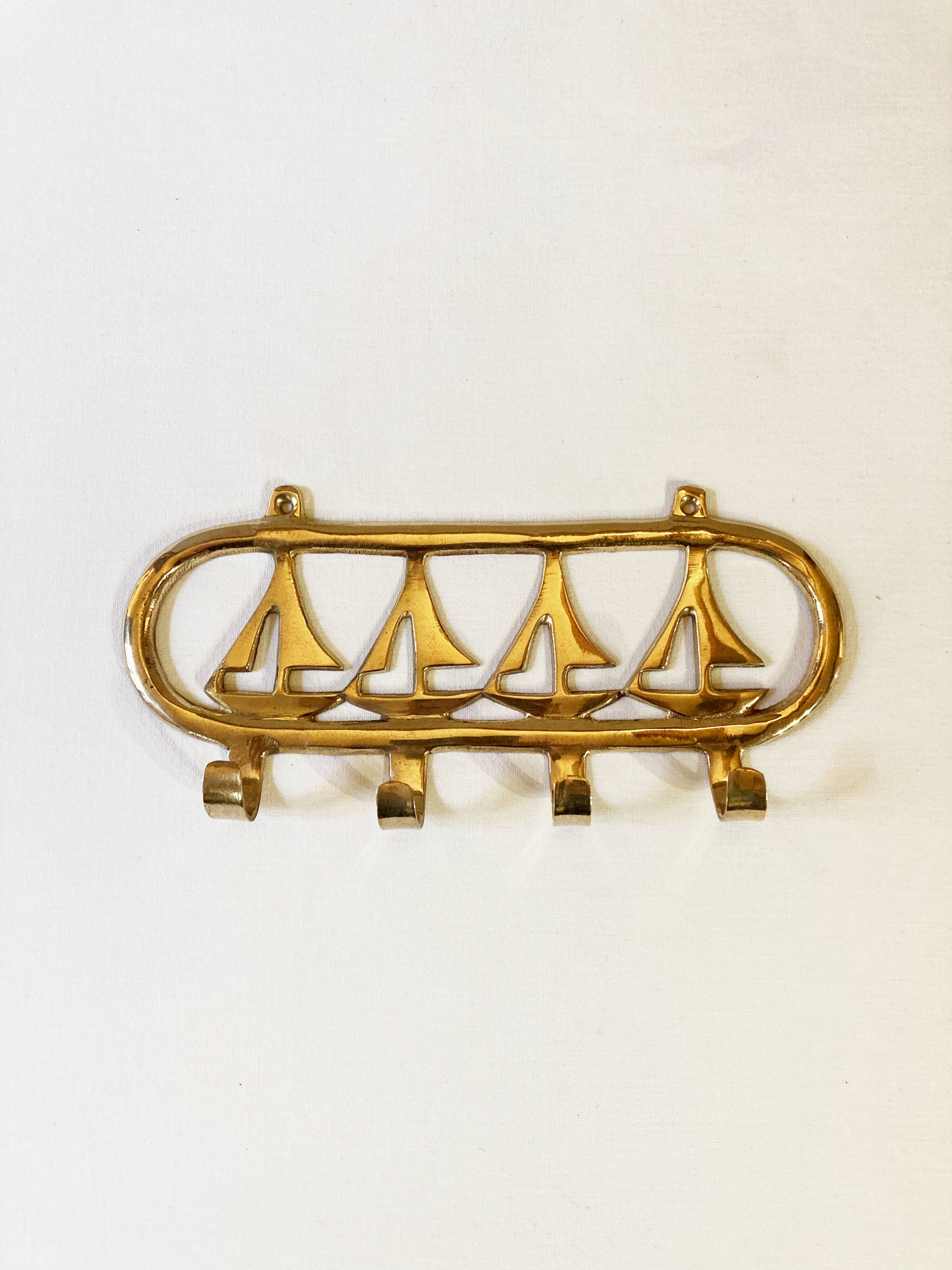Coat hook in gilded brass, sailboat motifs