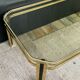 Table basse vintage années 70 en métal doré et verre fumé