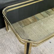 Vintage 1970s coffee table in gold metal and smoked glass.