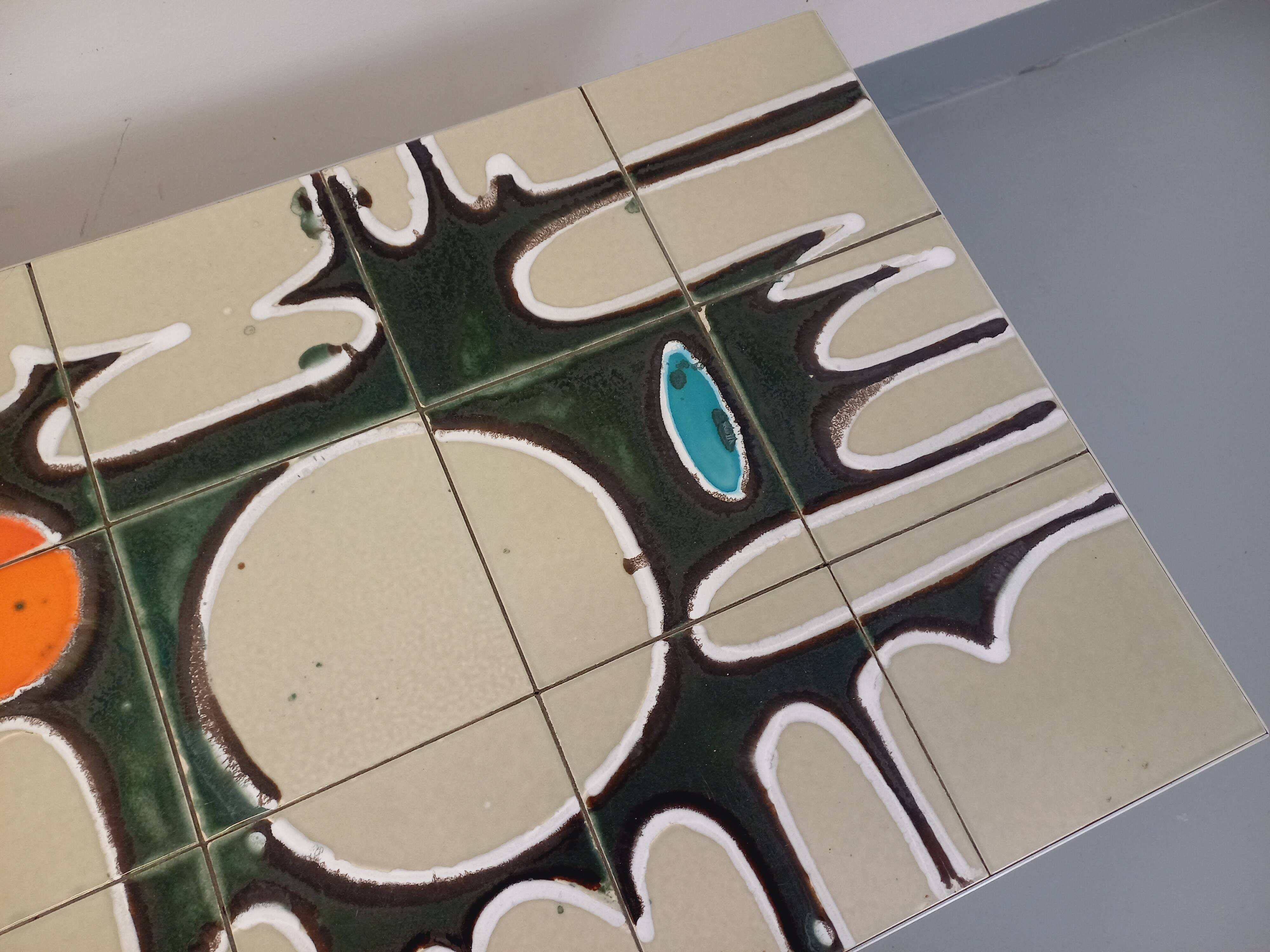 Vintage coffee table from the 60s and 70s in ceramic, chrome metal, and wood.