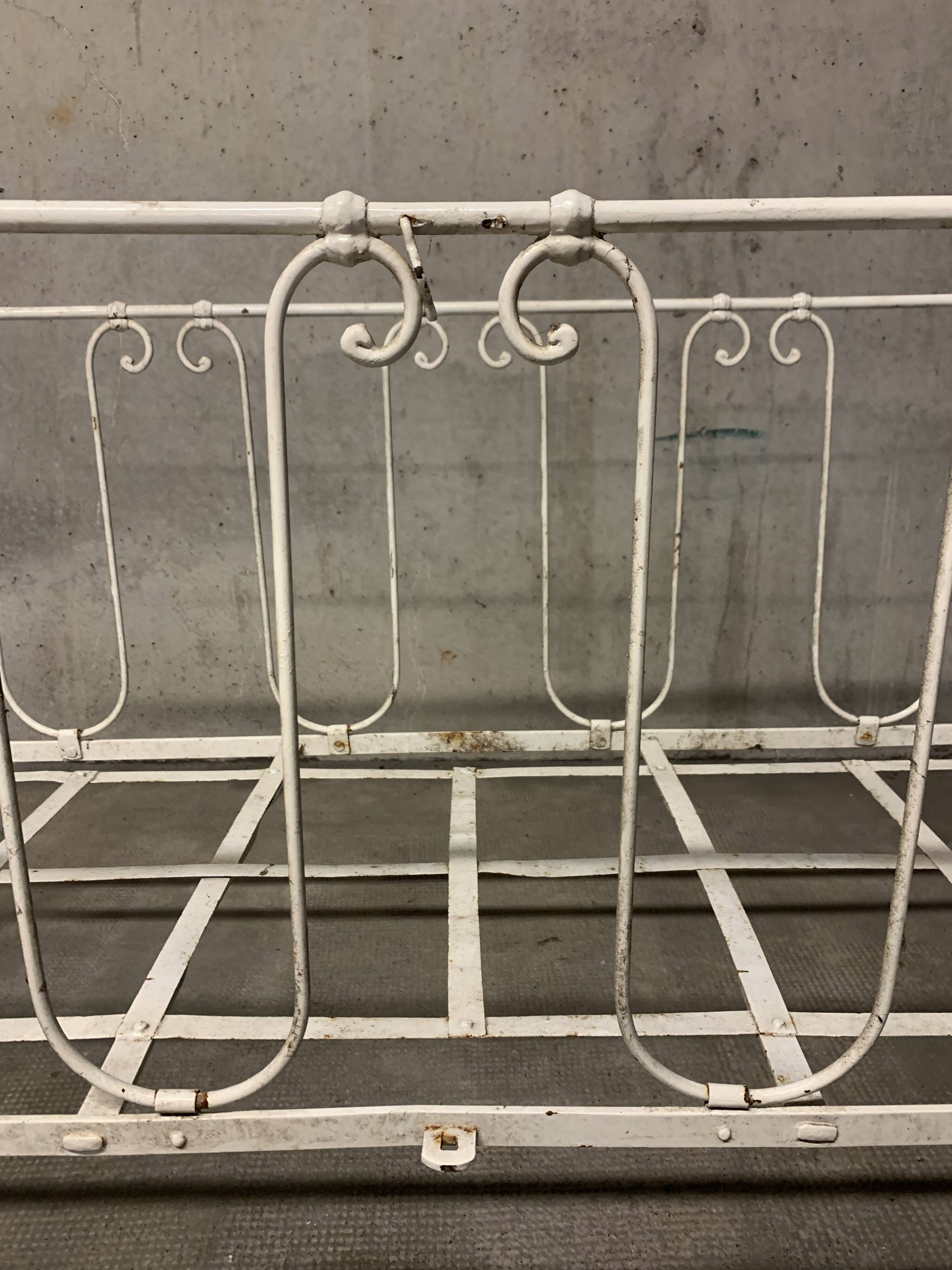 Old vintage wrought iron bench bed