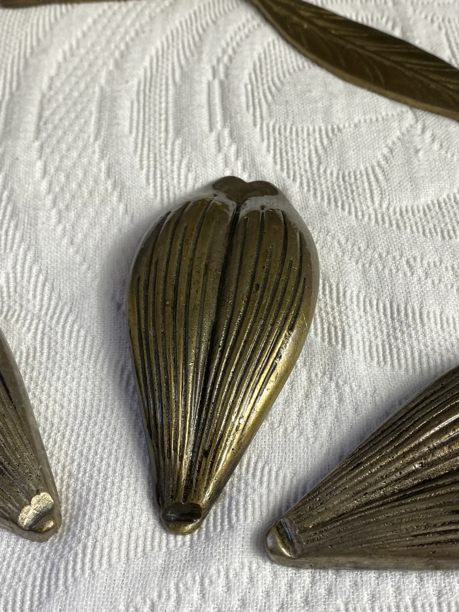 Flower candlestick and removable ashtrays in solid brass.