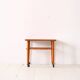 1960s teak coffee table on casters