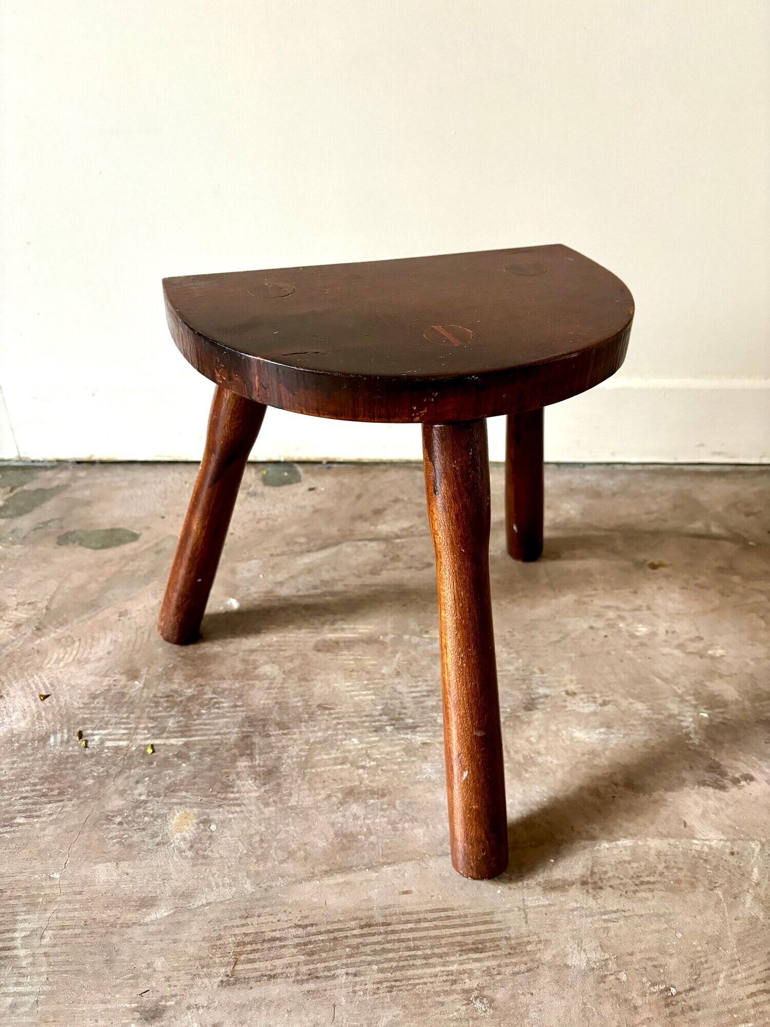 Dark wood tripod stool