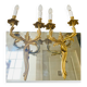 St Louis XV wall lights in solid gilded bronze with curved branches.