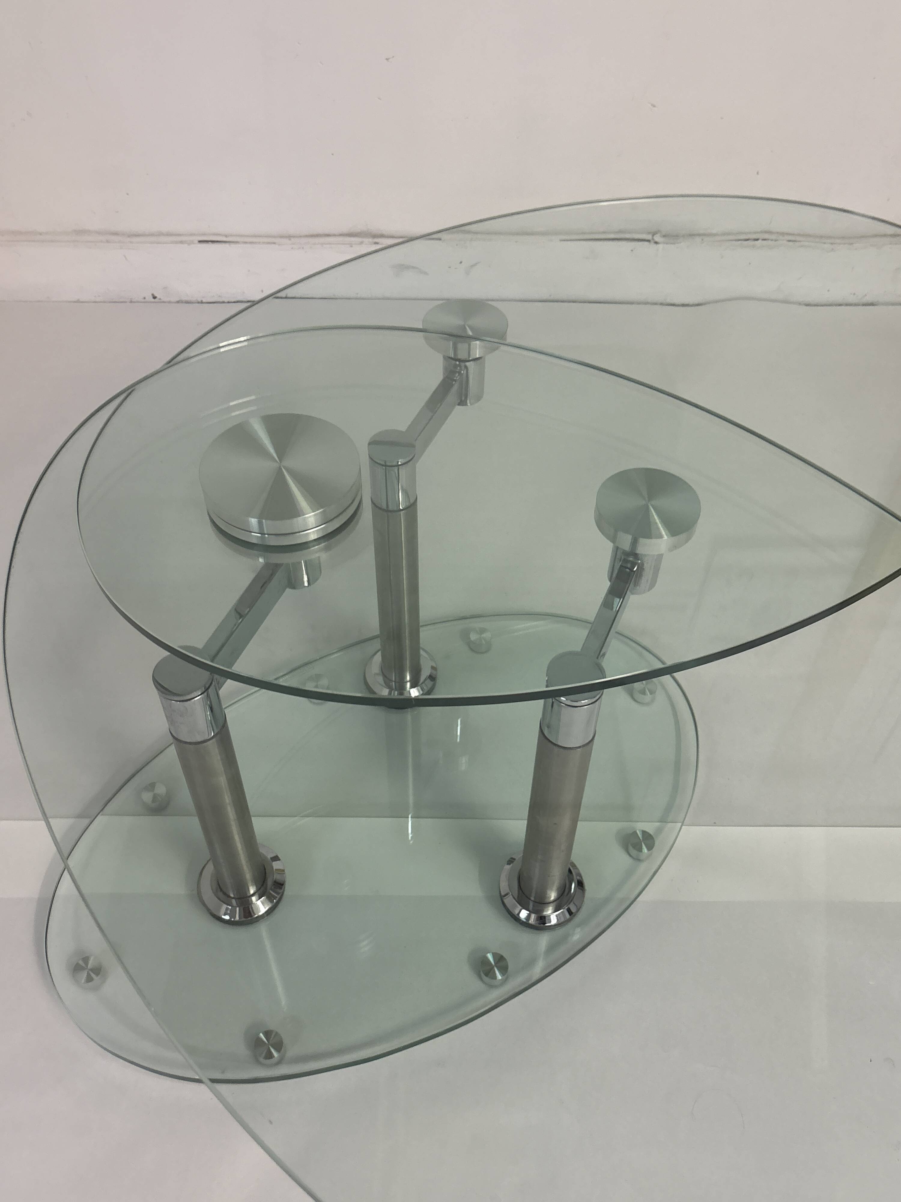 Oval designer coffee table in tempered glass