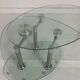 Oval designer coffee table in tempered glass