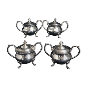 Set of four silver sugar mills