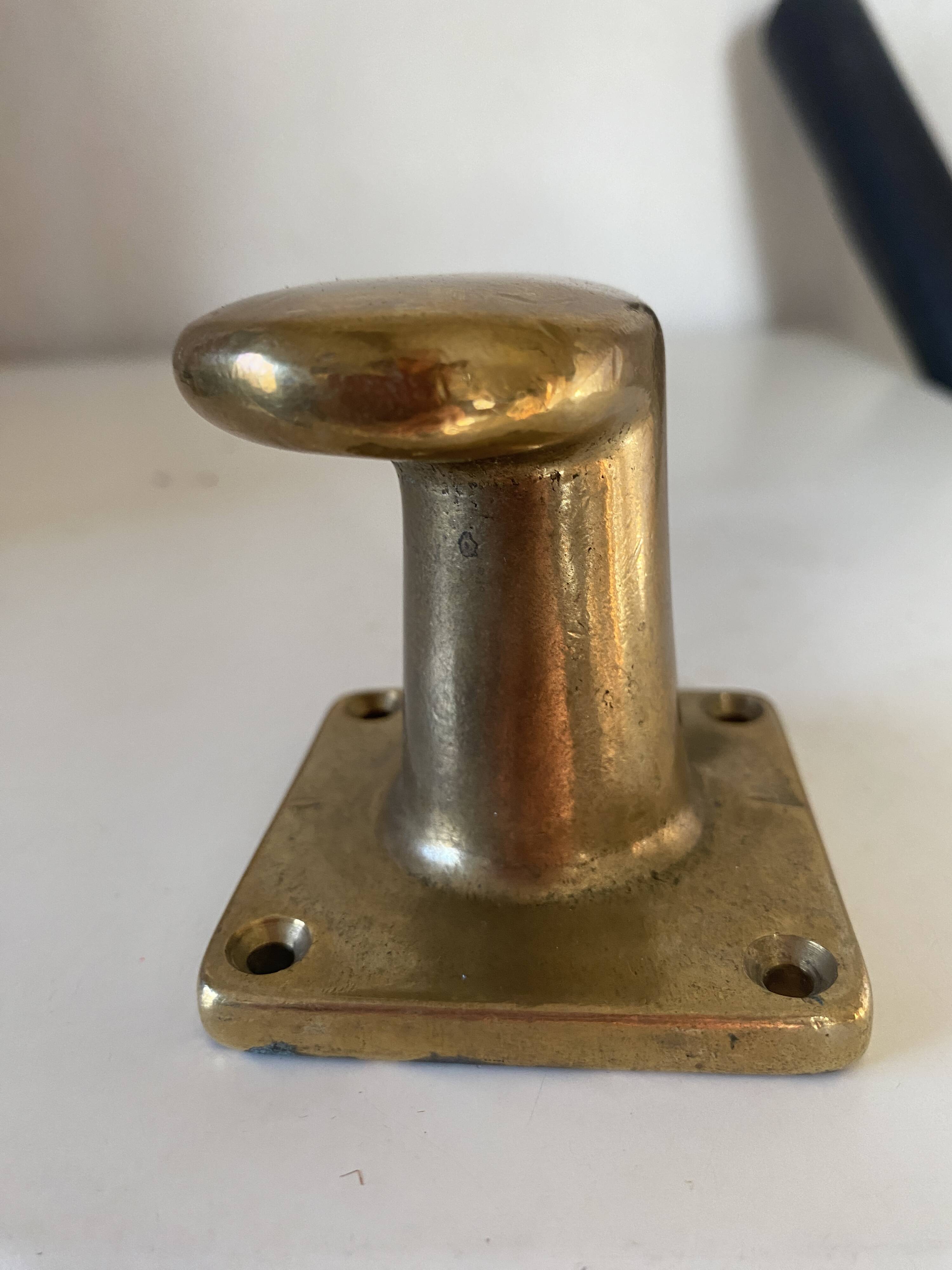 Pair of golden cast iron hooks