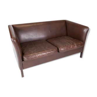 Two seater sofa upholstered with dark brown leather of danish design , by Stouby Furniture