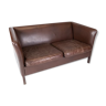 Two seater sofa upholstered with dark brown leather of danish design , by Stouby Furniture