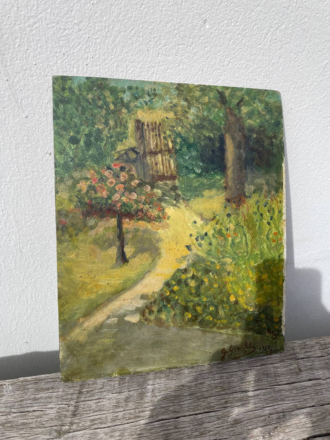 Paysage jardin à l’huile signé
