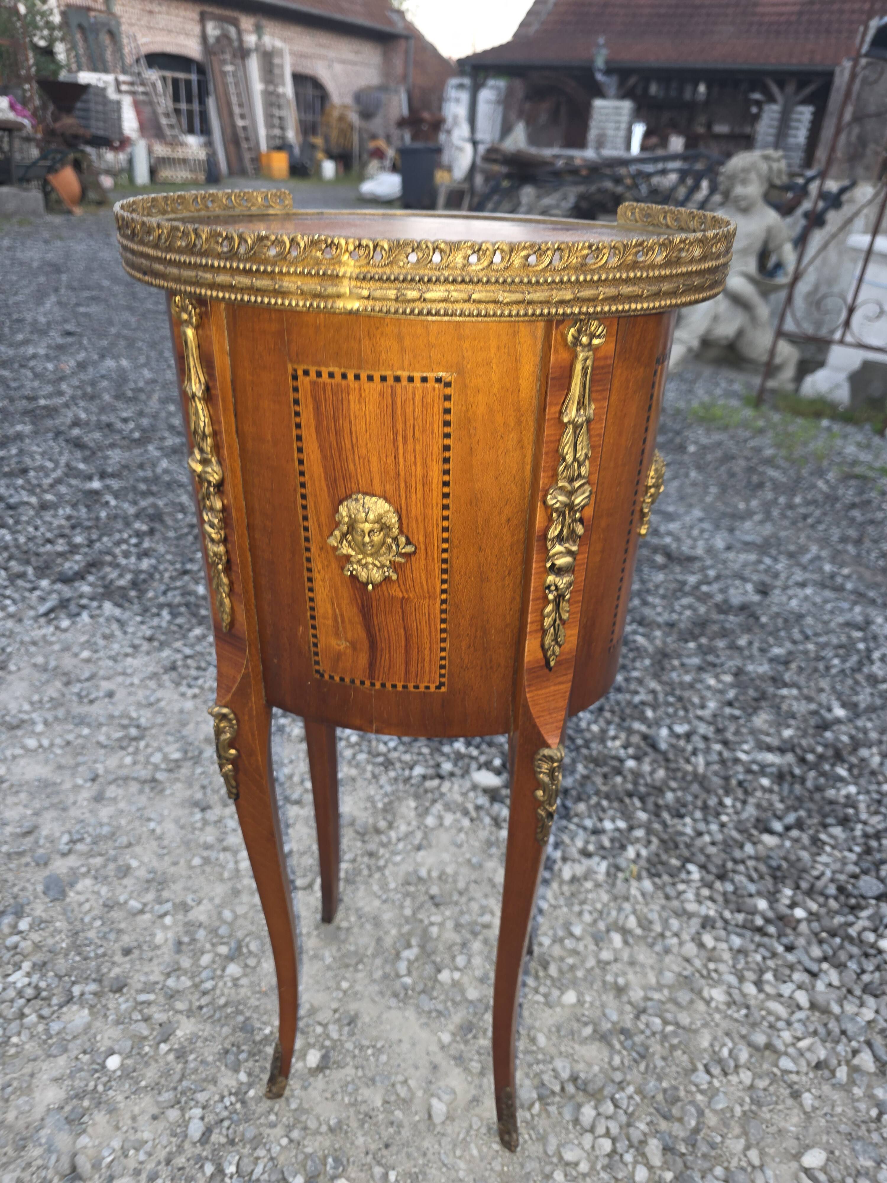Oval bedside table in Louis XV style with marquetry.