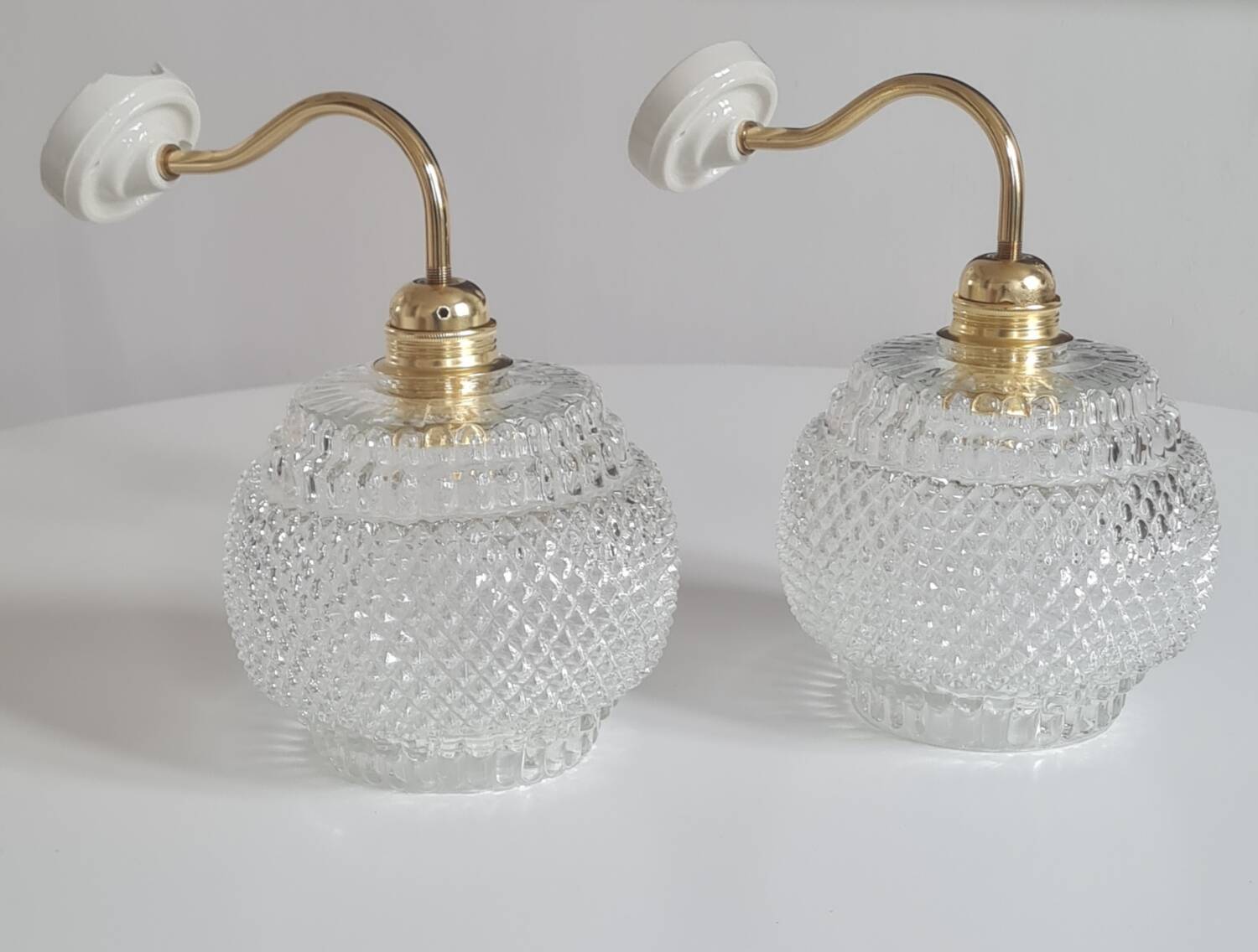 Pair of chiseled glass sconces