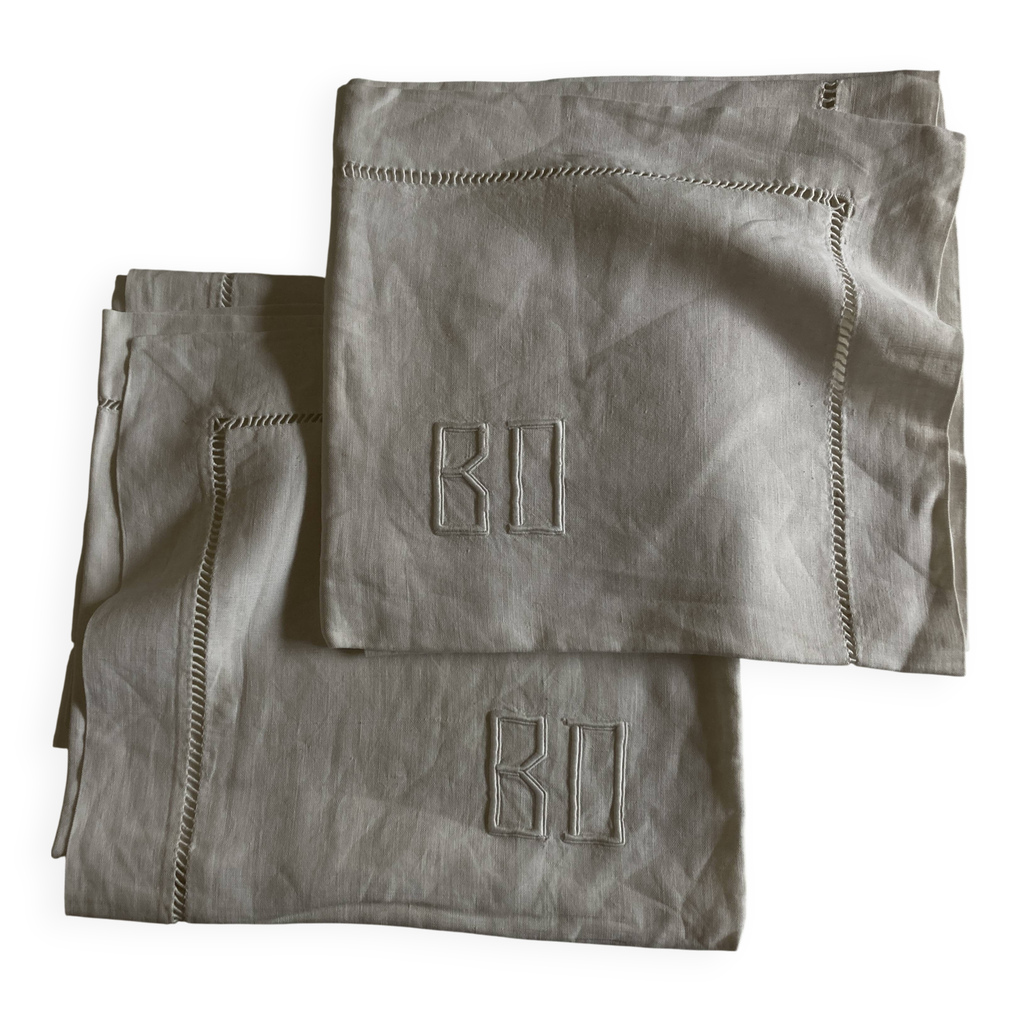 Pair of modernist linen pillowcases embroidered with comic strips